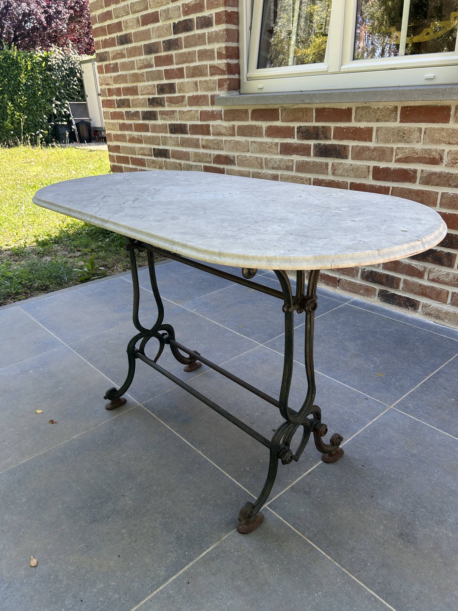 Art Nouveau cast iron and marble bistro table.