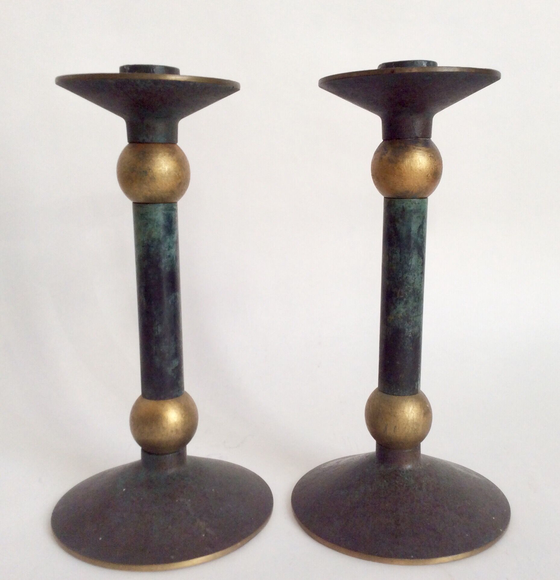 Pair of patinated bronze candlesticks