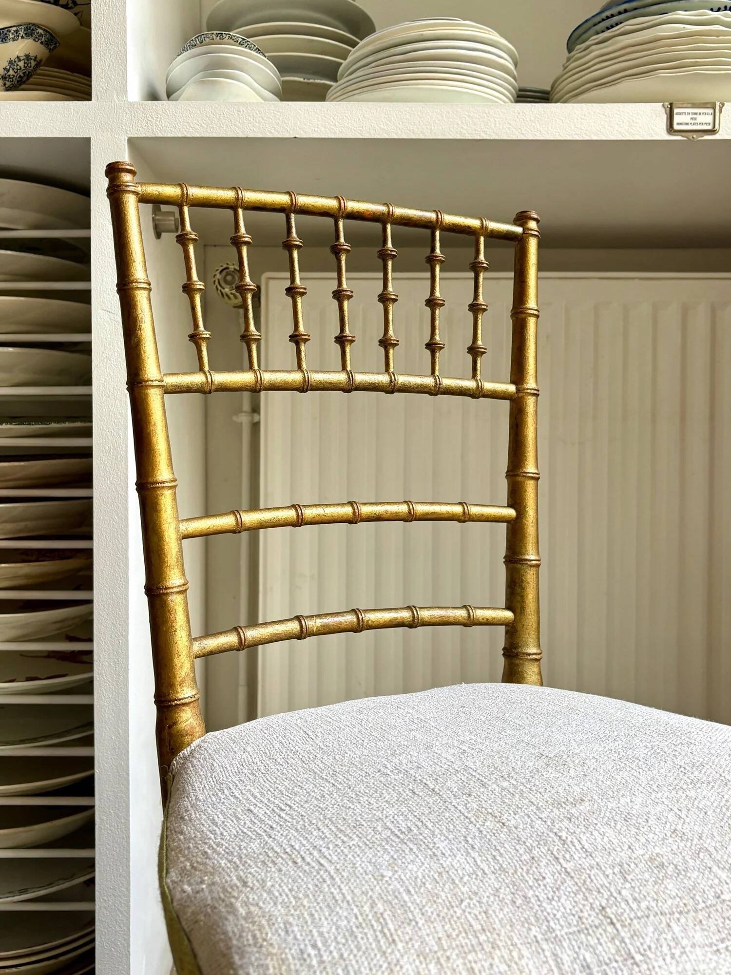 Napoleon III chair in gilded bamboo wood and beige cotton.