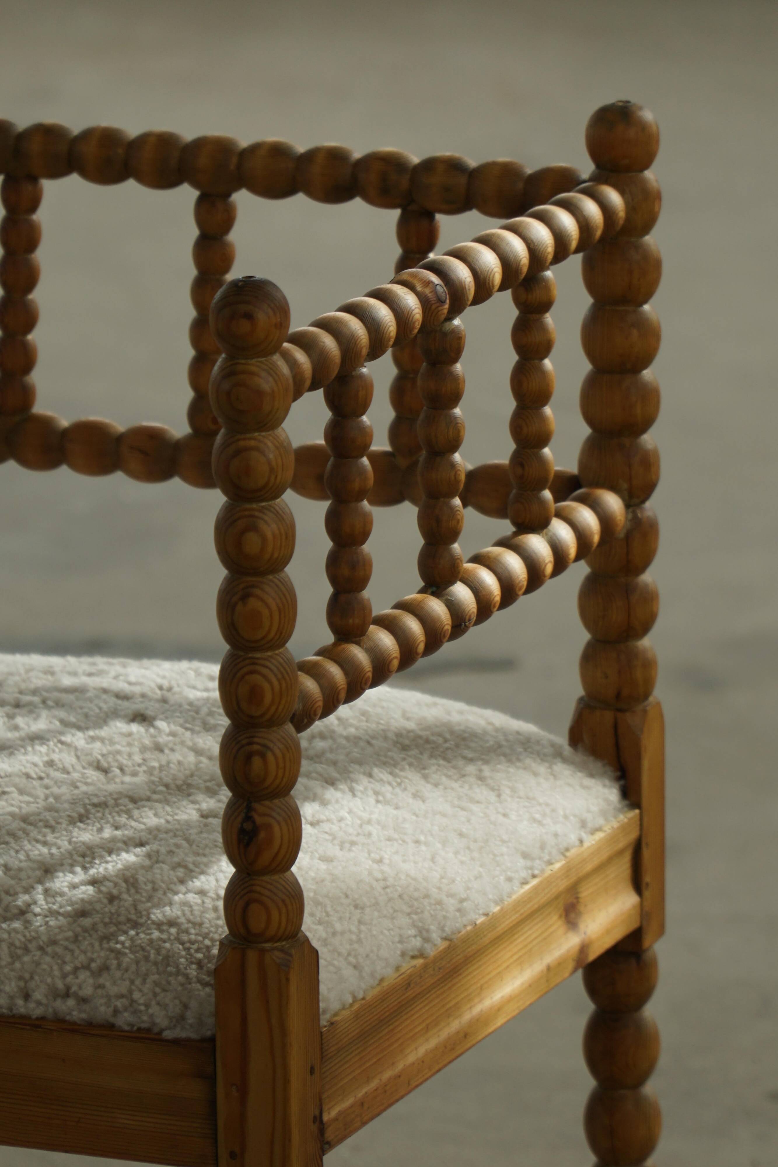 Antique French corner chair handcrafted with lamb's wool, early 20th century.