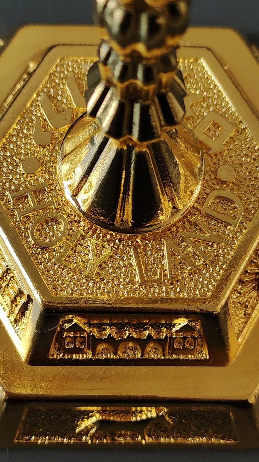 Menorah/Jewish/Hebrew candlestick with 7 arms of light. Engraved with the symbols of the 12 tribes of Israel/Holyland inscription. In gold metal. Size 20 x 16 cm