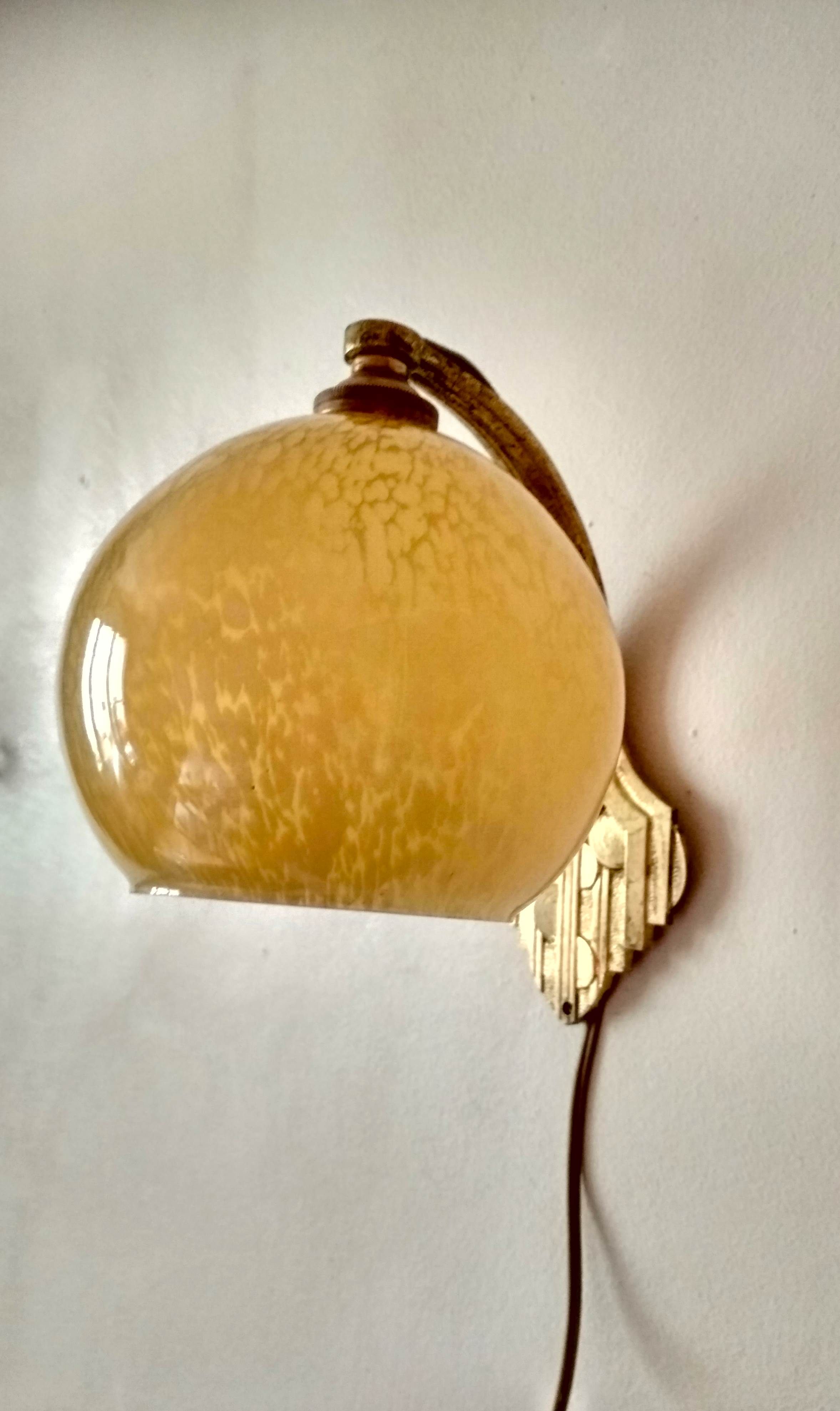 Art deco sconce, golden brass and yellow speckled Clichy glass globe