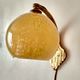 Art deco sconce, golden brass and yellow speckled Clichy glass globe