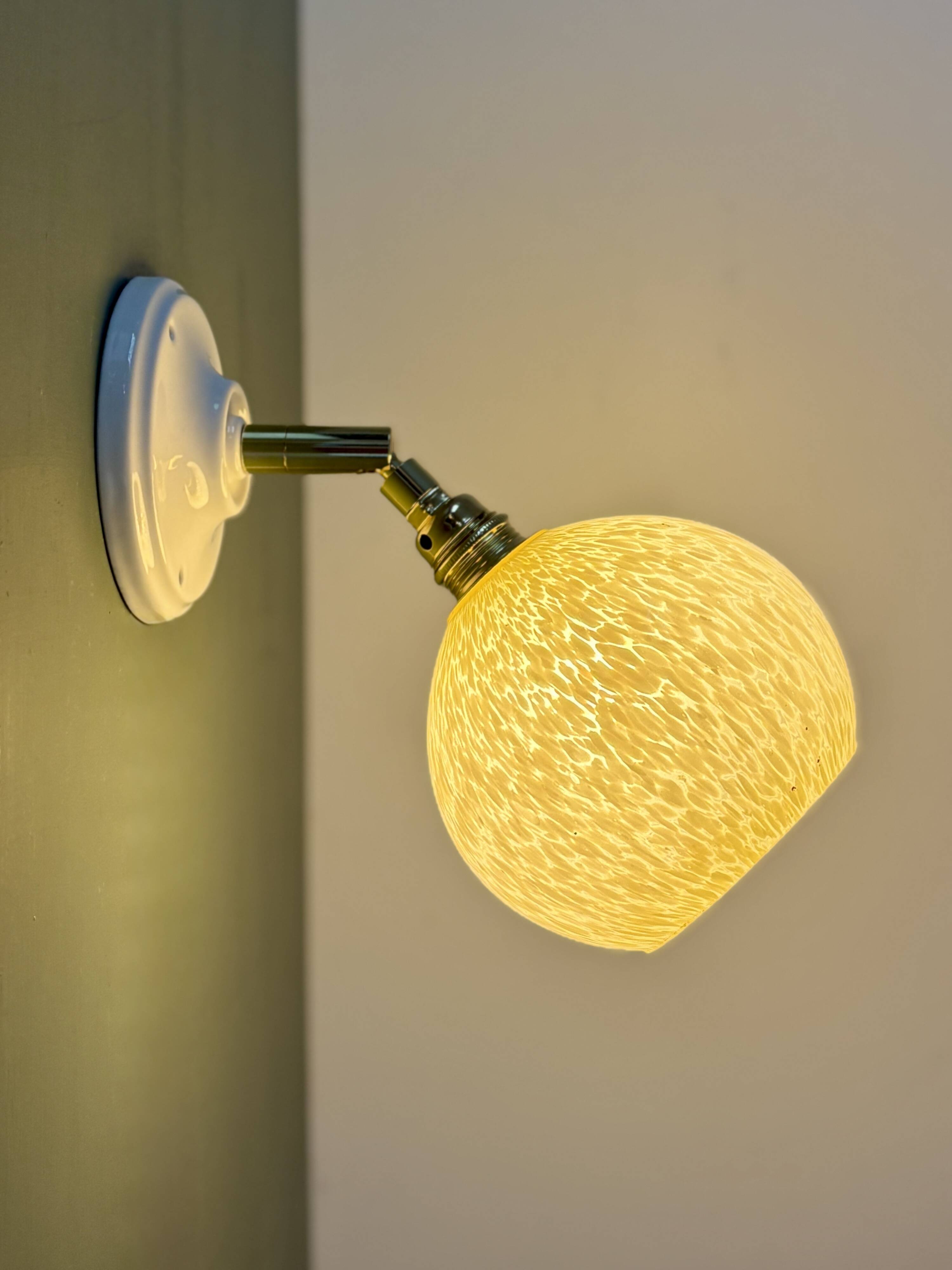 Vintage glass globe wall light in pale yellow from Clichy.