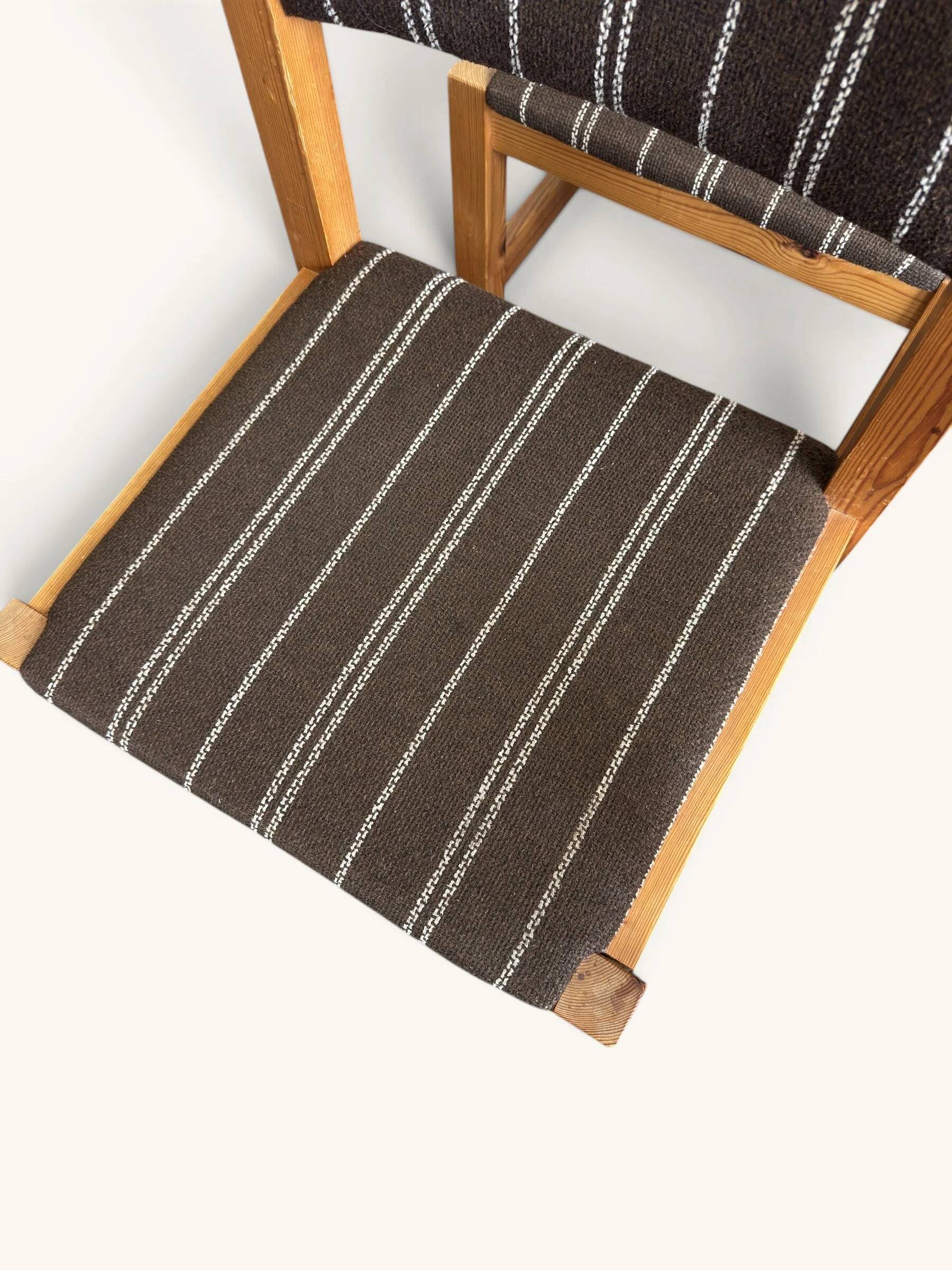 Set of 4 Danish dining chairs with brown striped upholstery.