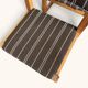 Set of 4 Danish dining chairs with brown striped upholstery.