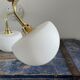 Set of two electrified white opaline wall lamps to nine