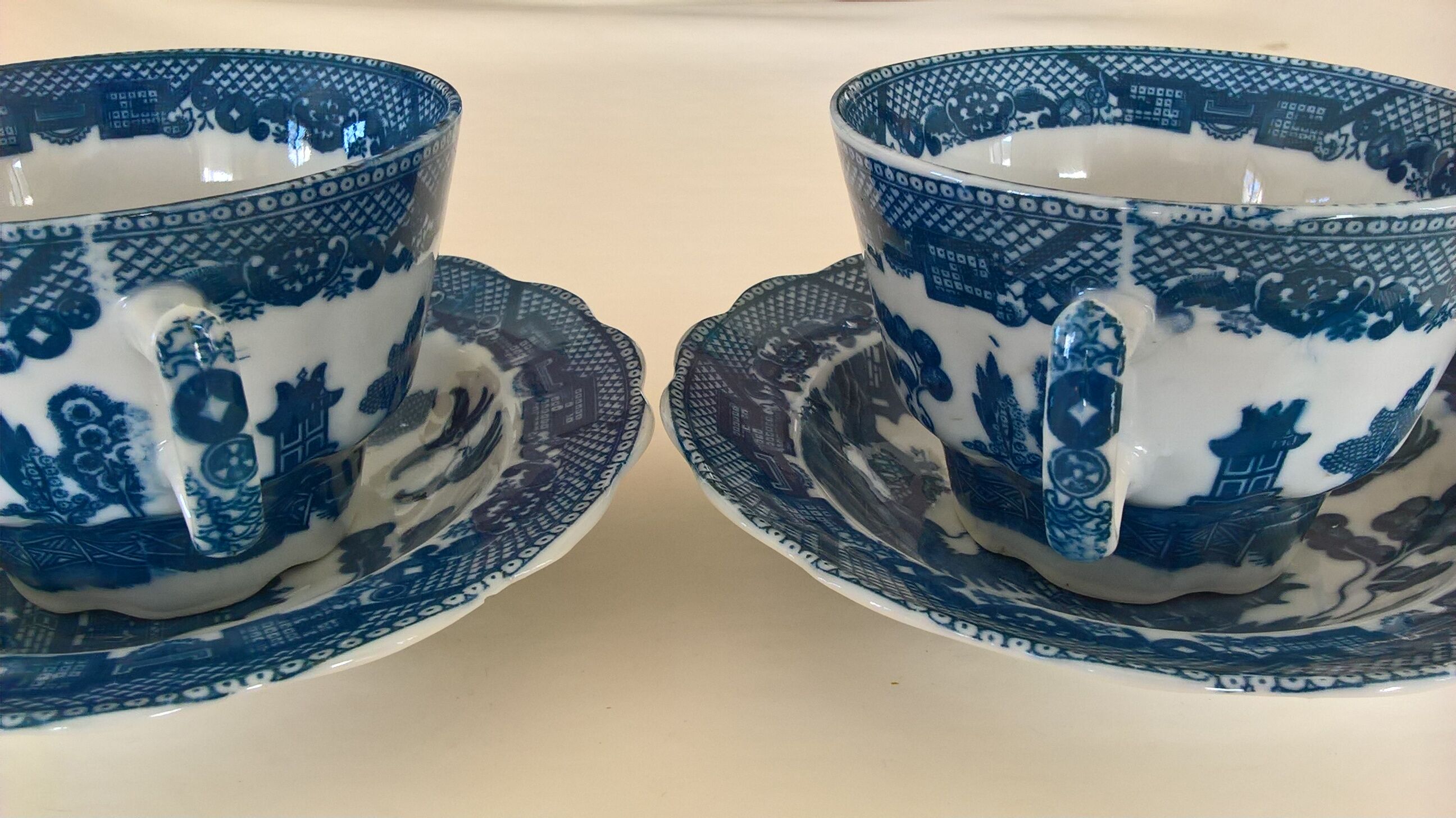 Two Blue Willow porcelain tea cups