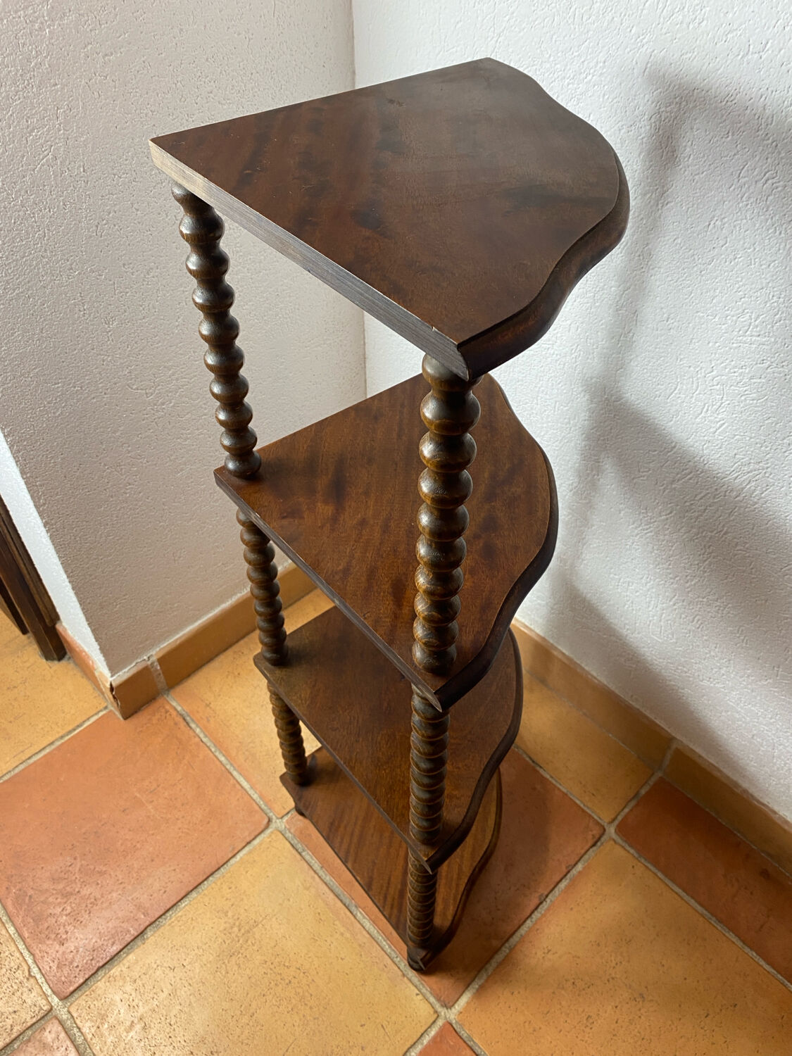 Corner shelf on a turned wooden stand