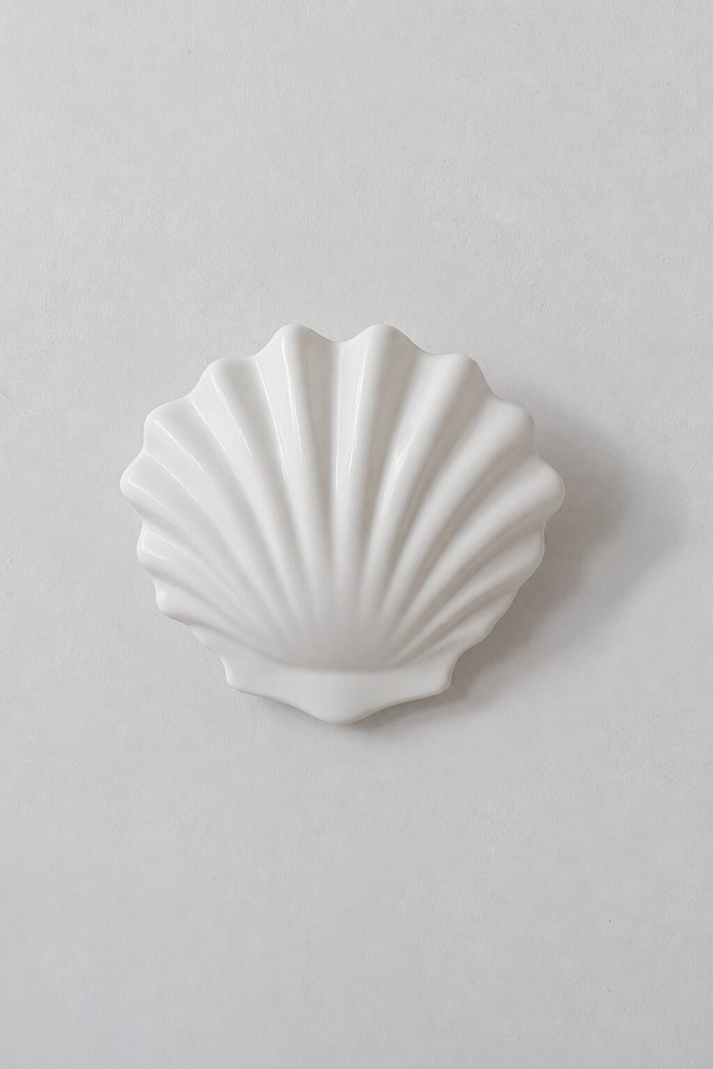 Vintage pair of white porcelain wall lights, France 1970.