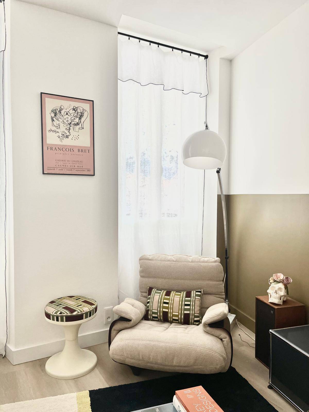 Marsala armchair and its light beige Ligne Roset footrest.