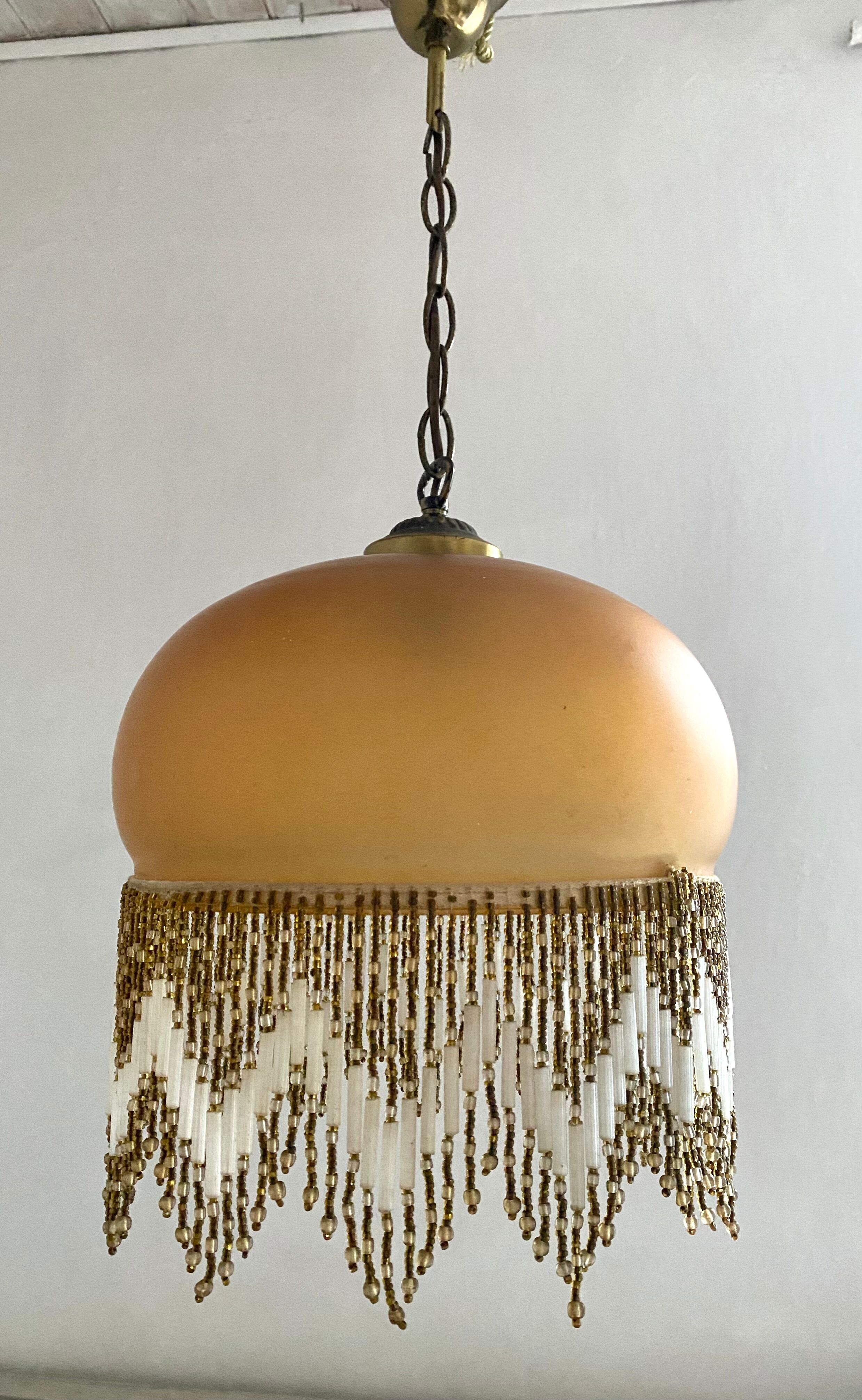 Amber polished glass and pearl suspension