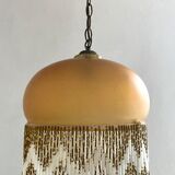 Amber polished glass and pearl suspension
