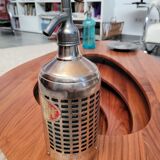 Seltzer water siphon in its protective grid