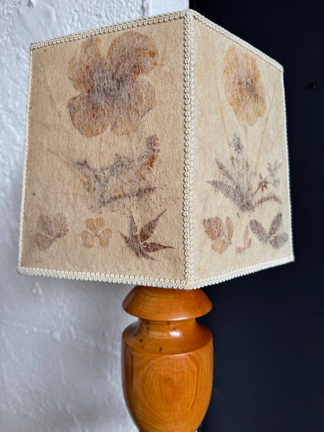 Turned wood lamp with a herbarium lampshade from the 1970s.