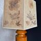 Turned wood lamp with a herbarium lampshade from the 1970s.