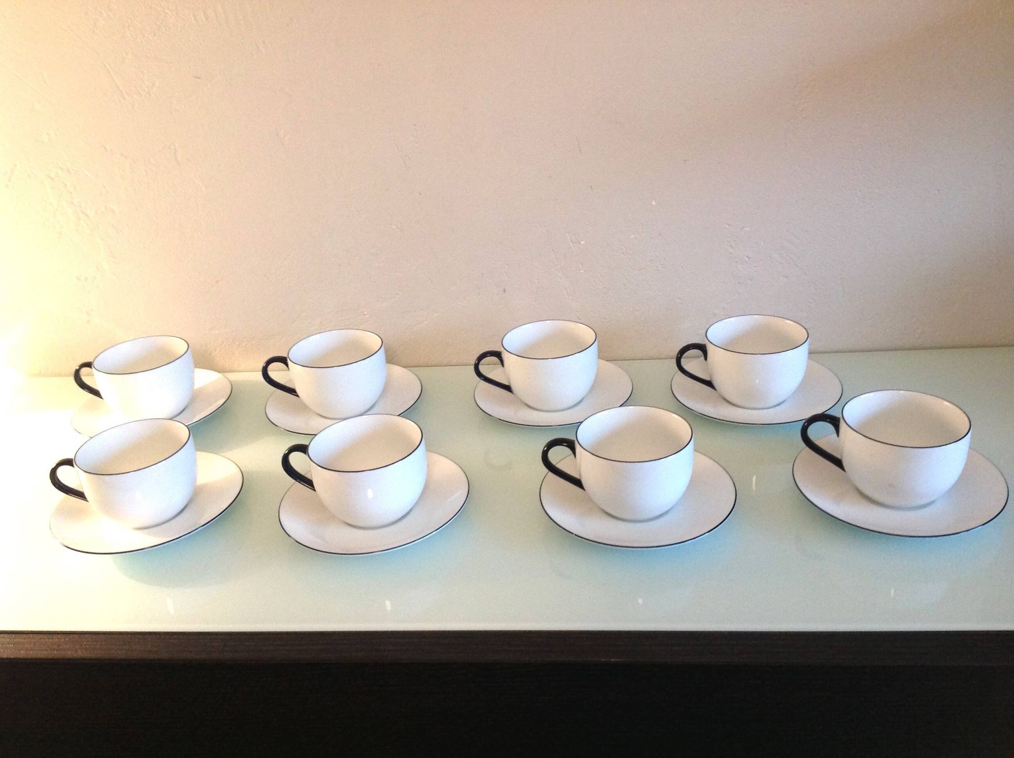 Set of eight white porcelain cups with blue edging / vintage 70s-80s