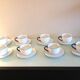 Suite de huit tasses en porcelaine blanche à liseré bleu / vintage années 70-80