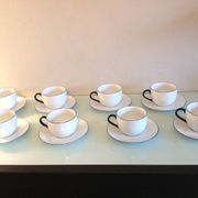 Set of eight white porcelain cups with blue edging / vintage 70s-80s