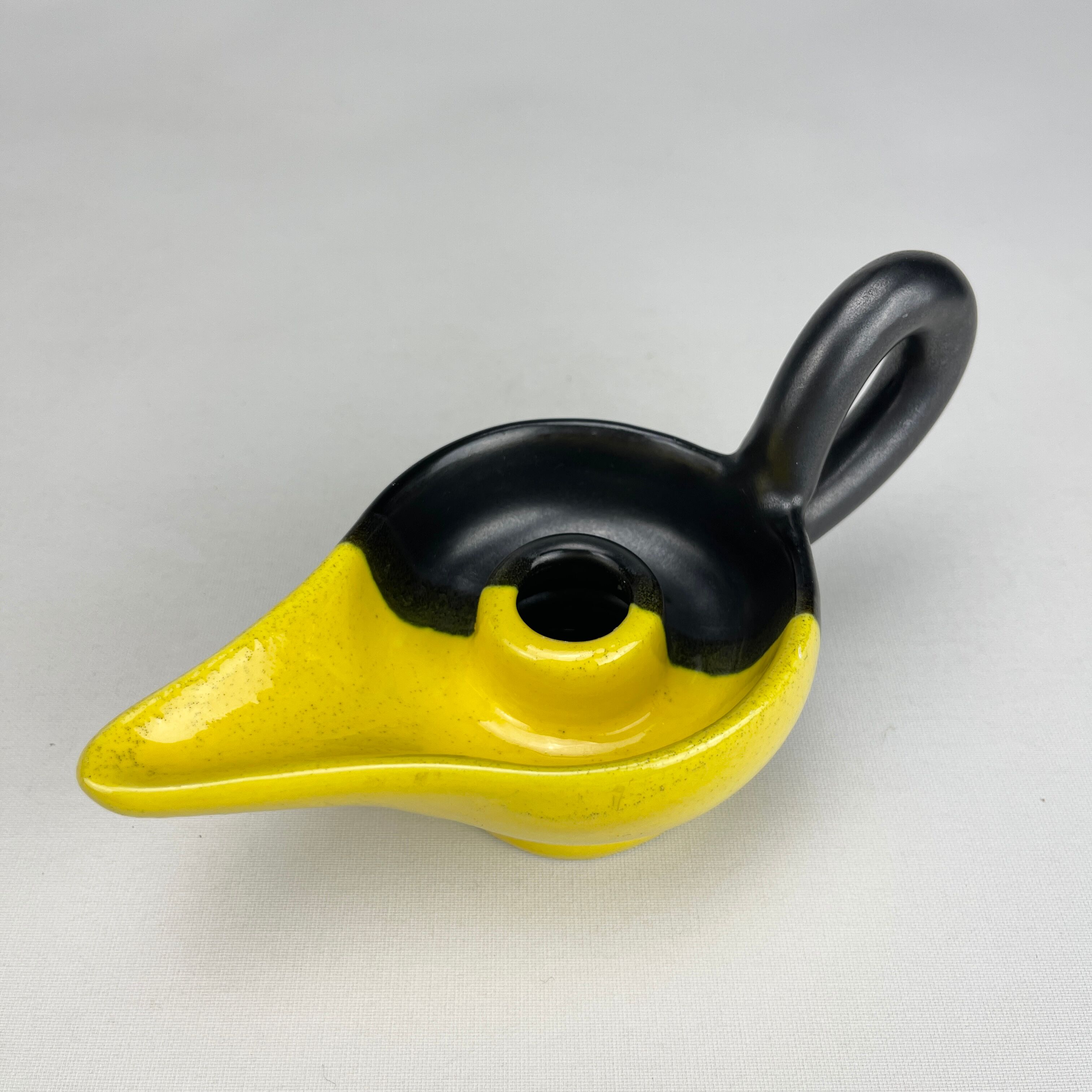 Mid-century yellow and black ceramic cellar rat candle holder