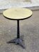 Round bistro table in cast iron and Bakelite, Louis Vuitton style, 1930s.