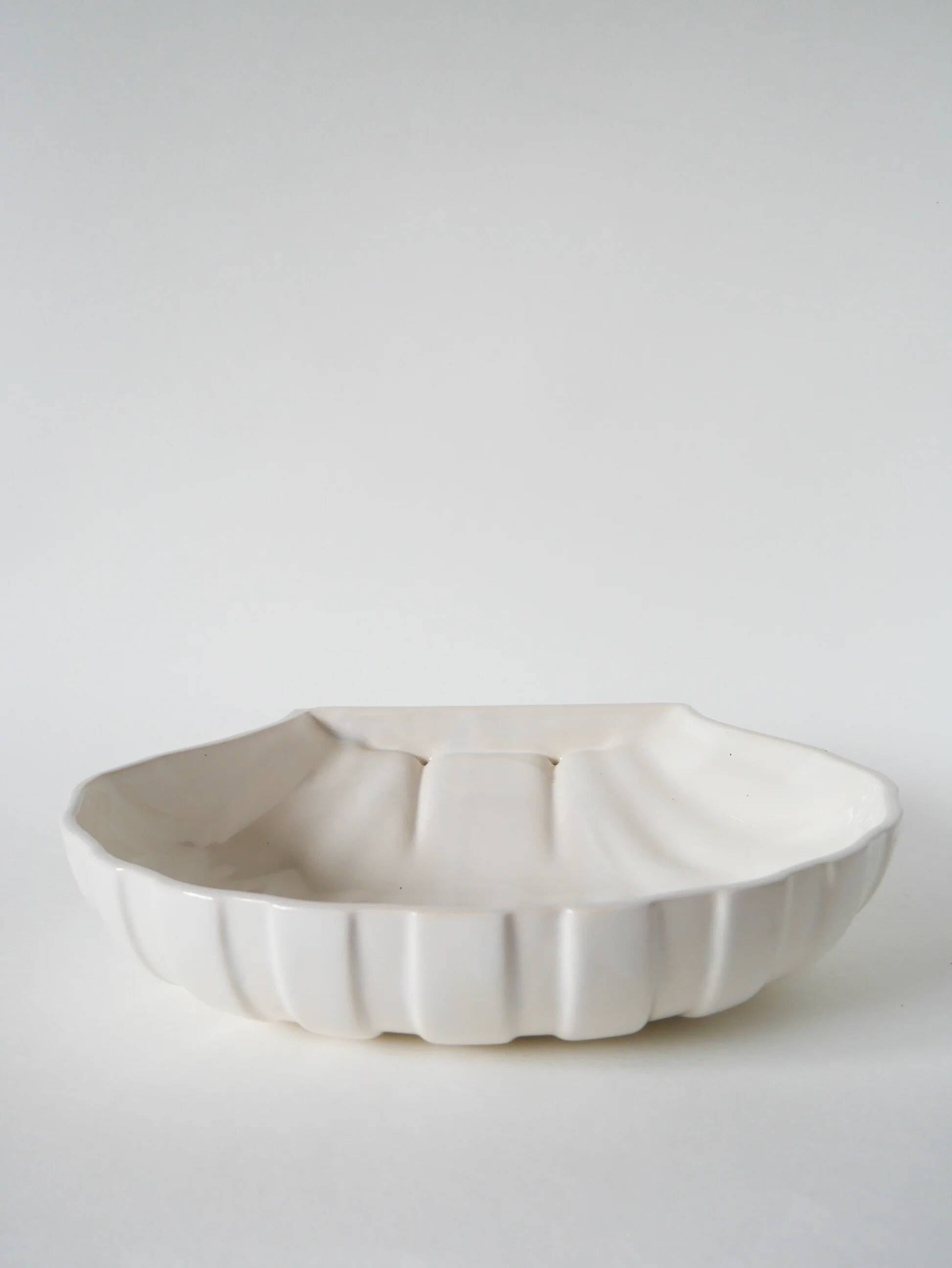 Large shell-shaped bowl to be placed or fixed, 1960.