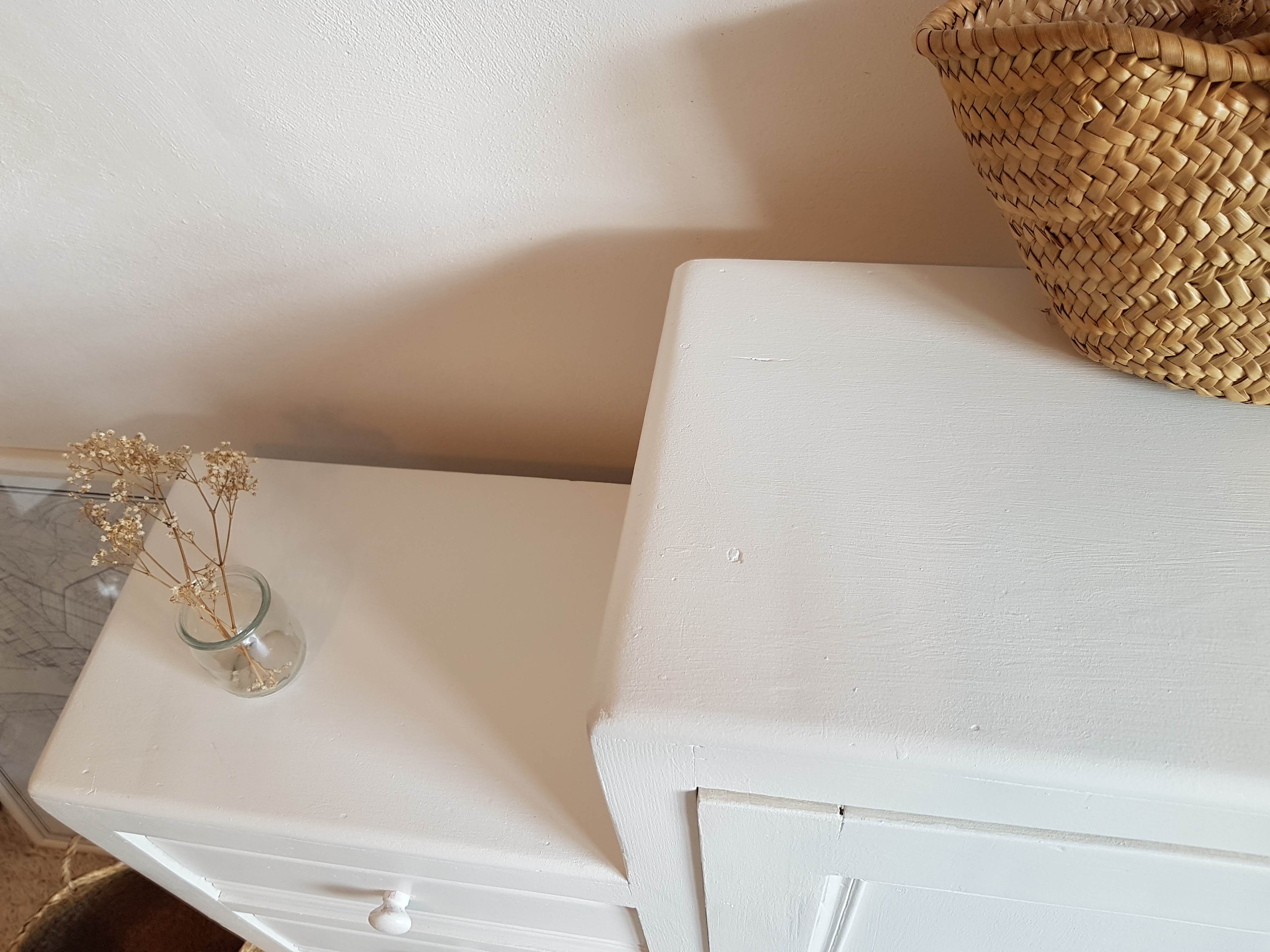 Old white asymmetrical chest of drawers
