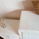 Old white asymmetrical chest of drawers