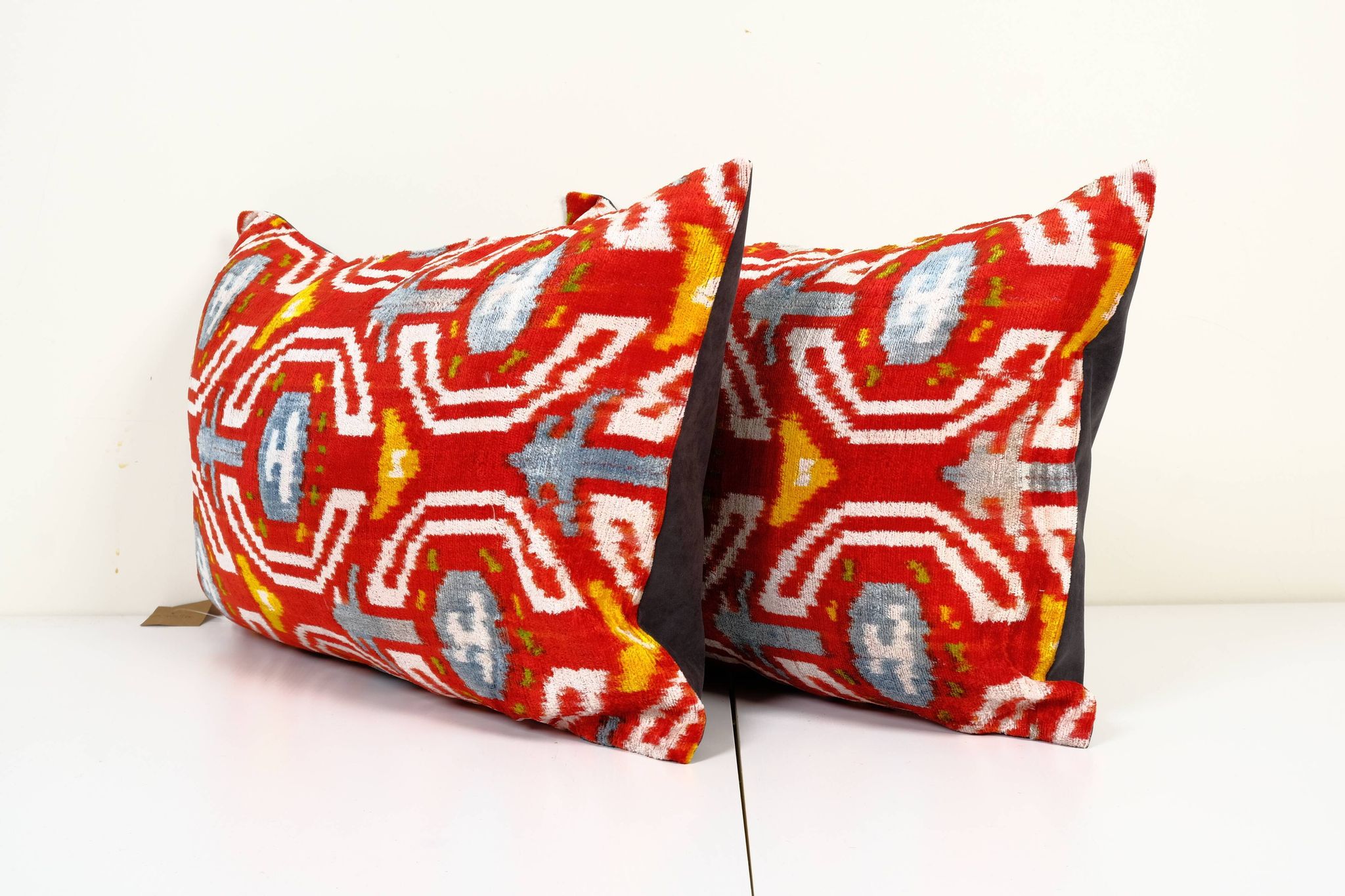 Set of two red ikat velvet lumbar pillows