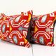 Set of two red ikat velvet lumbar pillows