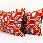 Set of two red ikat velvet lumbar pillows