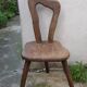 3 brutalist wooden tripod chairs