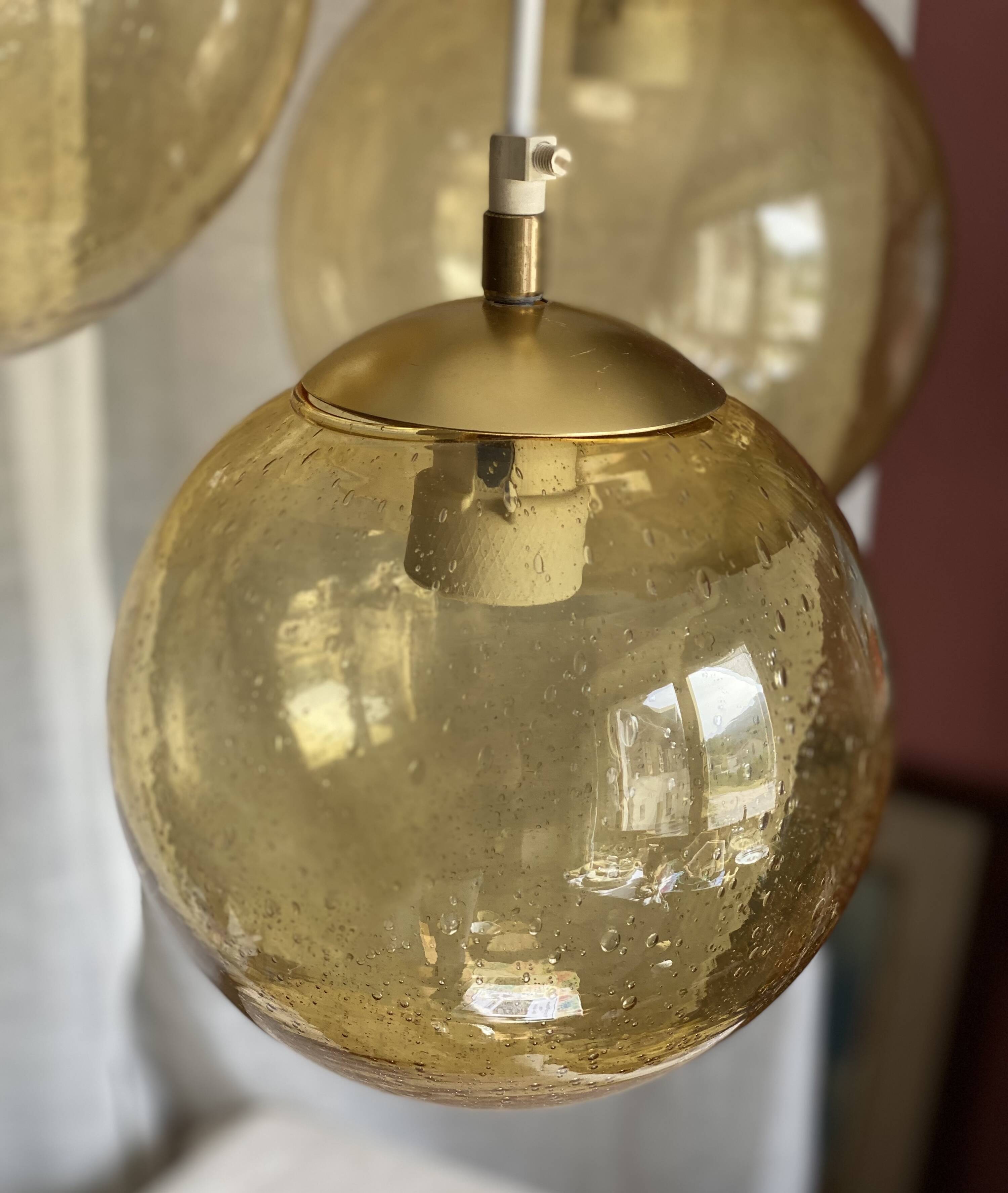 Suspension cascade with 3 globes of vintage golden yellow bubbles from the 1970s.