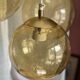 Suspension cascade with 3 globes of vintage golden yellow bubbles from the 1970s.