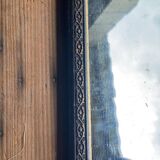 Antique mirror in black and gold wood