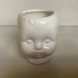 Baby doll shaped vase planter