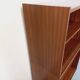 Vintage wooden bookshelf in teak style from the 1960s.