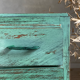 Vintage compass leg commode with a patina.