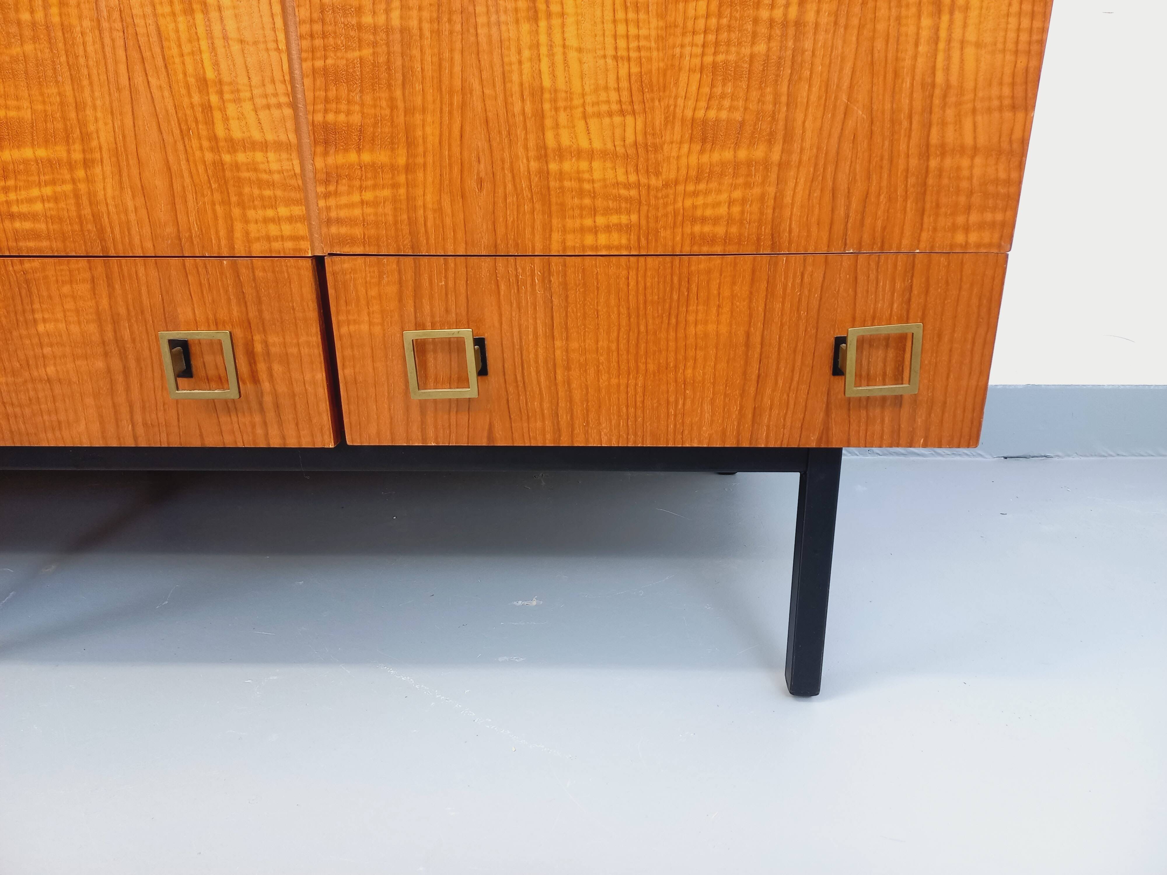 Vintage modernist wardrobe in teak and metal from the 1960s.