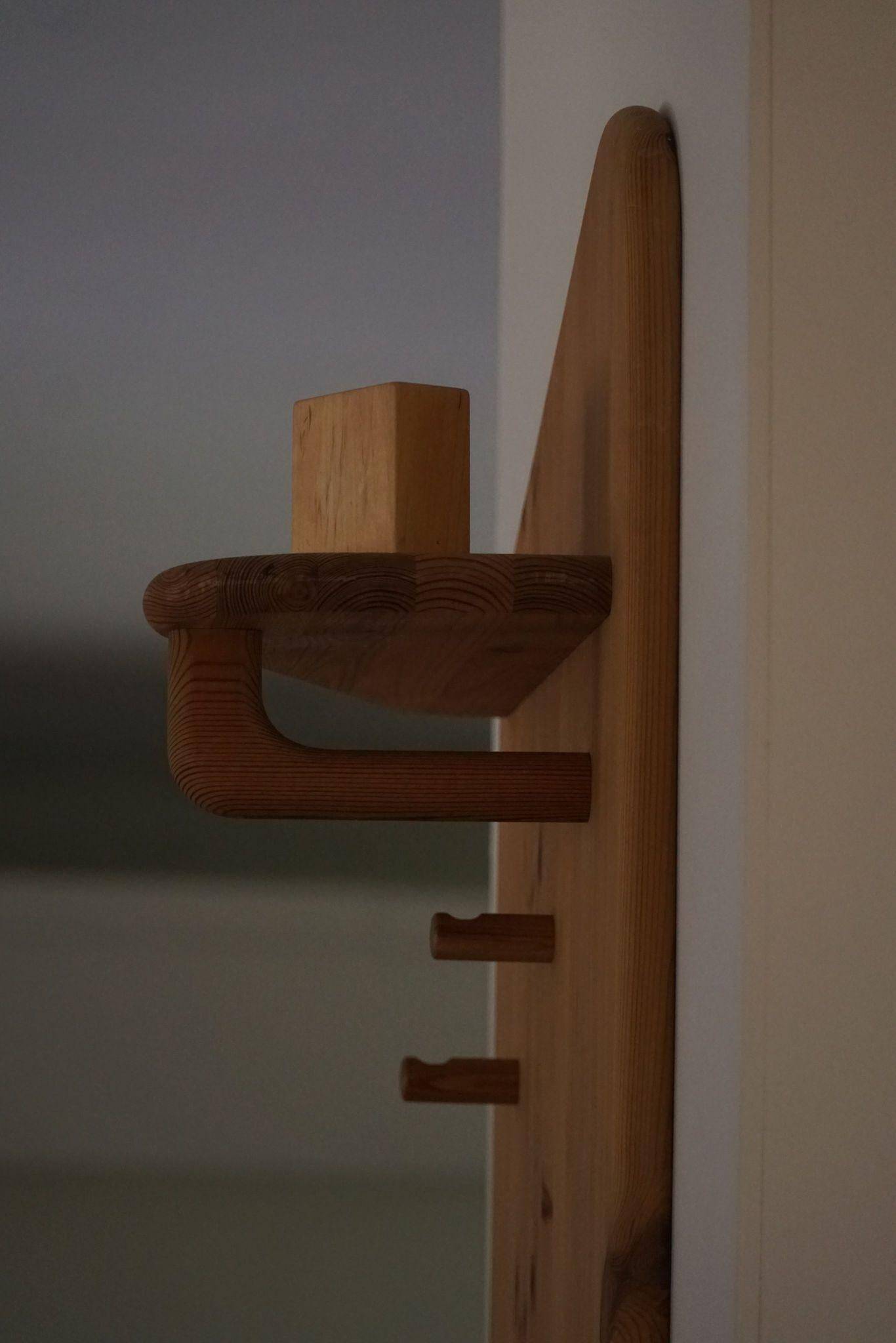 Sculptural wall-mounted coat rack in solid pine, Danish modern, 1980s.
