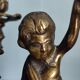 Pair of antique candlesticks in cherub bronze