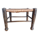 Small rustic vintage stool in wood and straw.