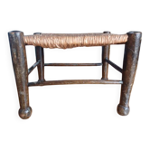 Small rustic vintage stool in wood and straw.