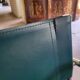 4 vintage Italian armchairs in green leather and chrome metal.