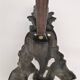 Pair of bronze andirons with black patina, 19th century, female caryatids