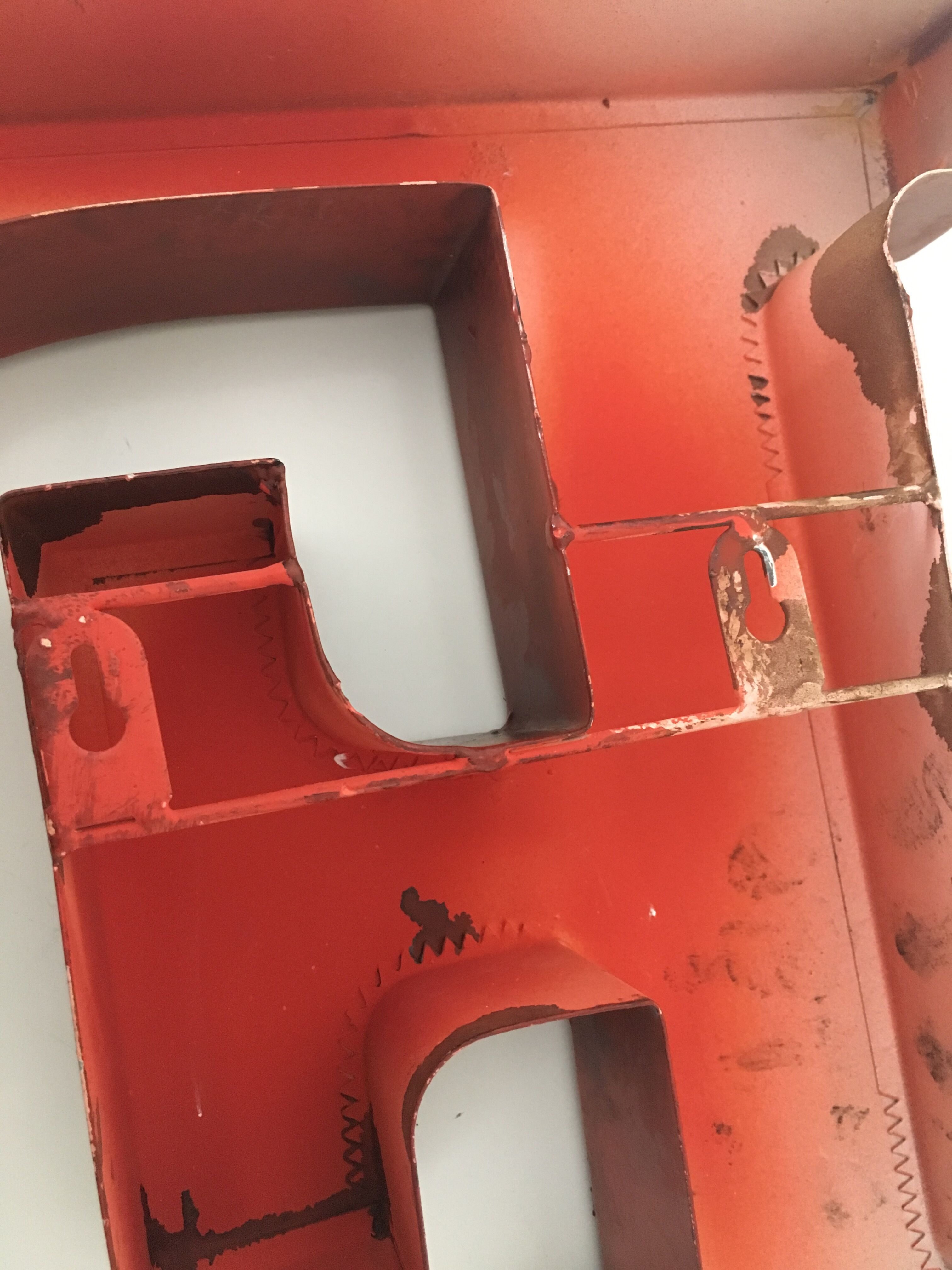 Red metal "F" sign letter