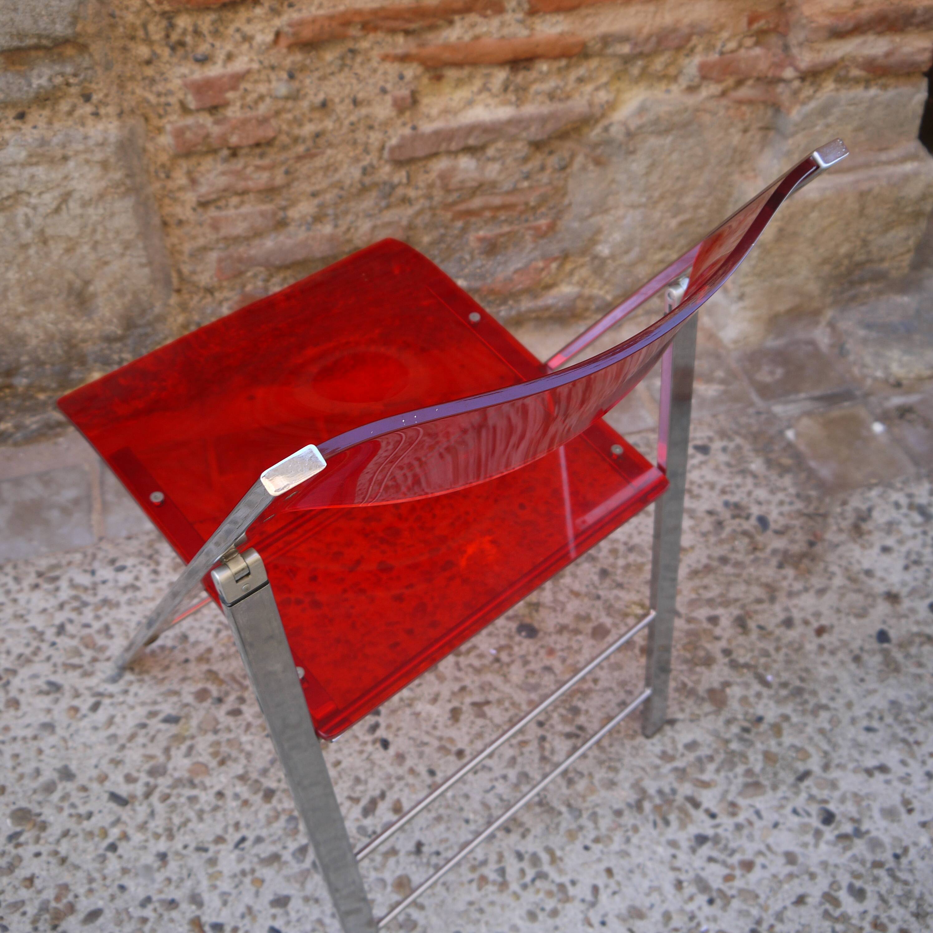 Red Plexiglas folding chair