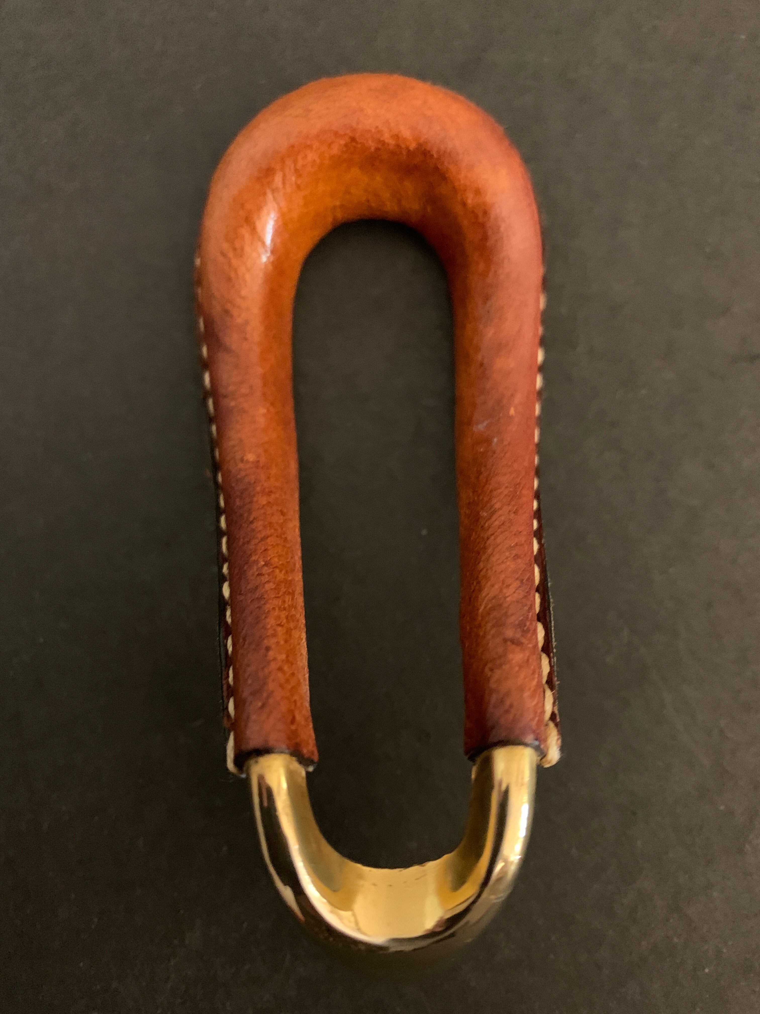 Carl Auböck pipe rack in leather and bronze, 1963