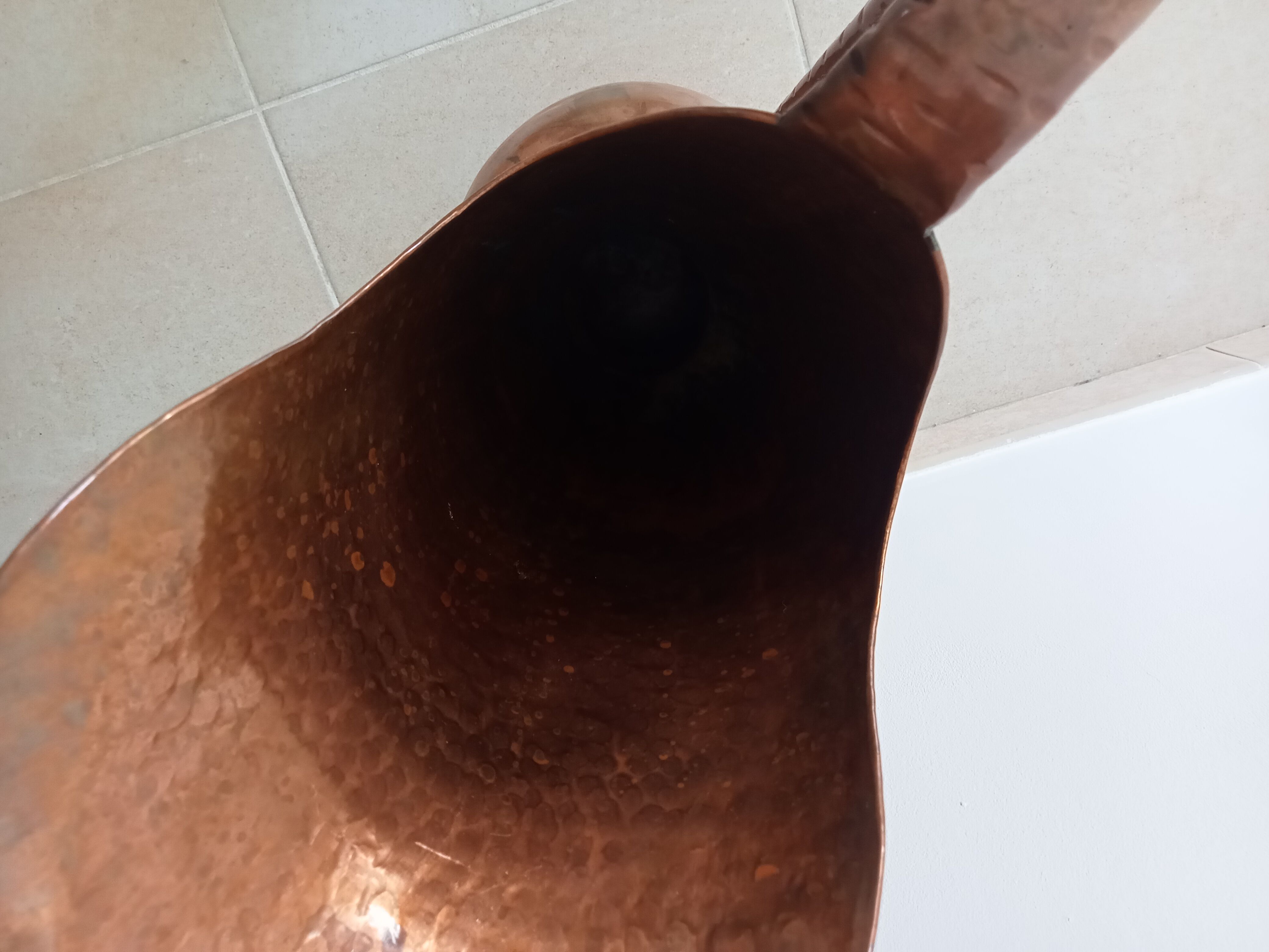 Old italian amphora vase in hammered copper