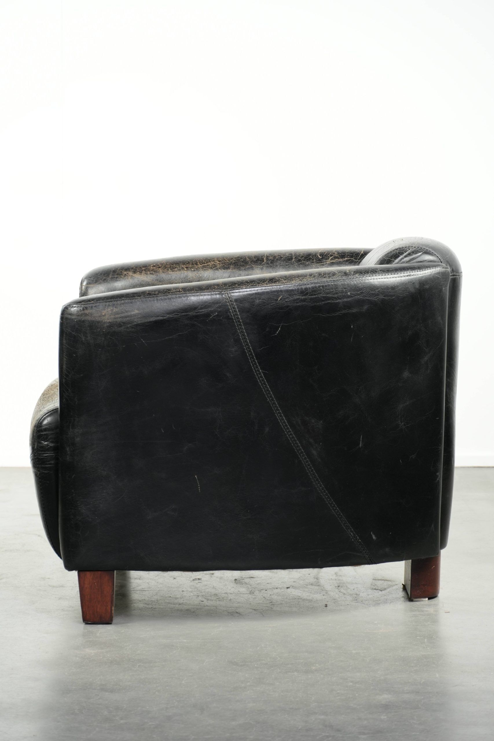Black vintage cowhide aviator design armchair with characterful appearance